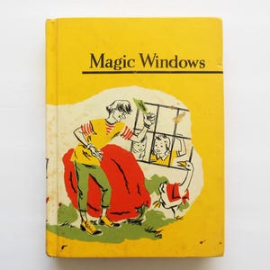 May include: Vintage children's book titled "Magic Windows" with a yellow cover. The cover illustration features a boy in a yellow shirt and green pants, a red cape, and a goose. The book's title is in black text.