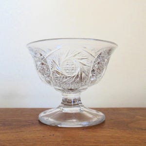 May include: A set of three ceramic mugs with a speckled, matte finish. The mugs are in shades of cream, light gray, and dark gray. Each mug has a simple, minimalist design, perfect for coffee or tea.