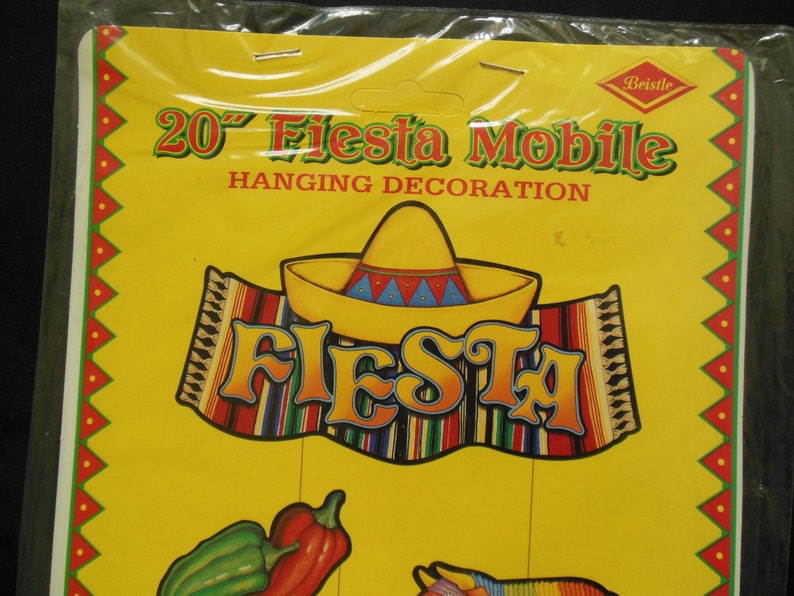 May include: A 20-inch Fiesta Mobile hanging decoration with a yellow sombrero, a red, green, and blue striped serape, and the word "Fiesta" in colorful letters.