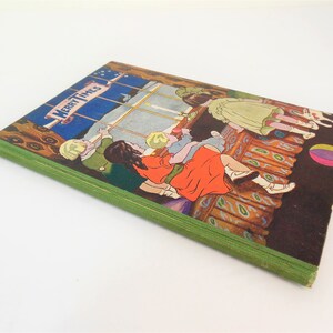 May include: A vintage children's book titled "Merry Times" with a green spine and a colorful illustration of children playing by a window on the cover.