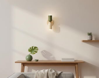 Aplique de pared metálico contemporáneo en tonos verde y beige suaves para una iluminación elegante del hogar.