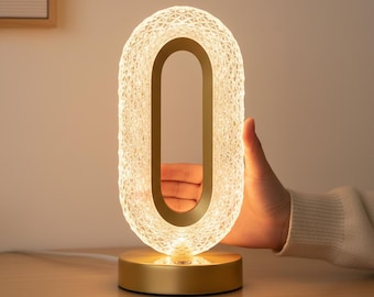 Modern Oval Table Lamp with Gold Base and Cut Out Design for Cozy Home Ambiance