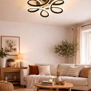 Lámpara de techo moderna con bucles entrelazados y LED que cambia de color.
