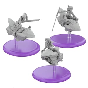 May include: Three gray miniature figurines of futuristic female characters riding stylized vehicles, each mounted on a purple circular base. One figure holds a sword, another a staff, and the third has no weapon. The figures are detailed and dynamic.