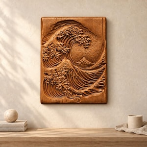 May include: A rectangular wooden wall plaque featuring a deep relief carving of a large crashing wave and a mountain peak in the background. The natural wood grain is visible throughout the textured surface, highlighting the intricate details.
