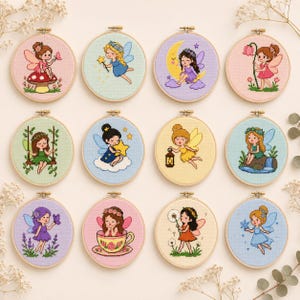May include: Twelve circular embroidery hoops featuring cross-stitch designs of fairies in various settings, including sitting on a mushroom, holding a star, resting on a crescent moon, swinging on vines, and interacting with flowers and nature elements.
