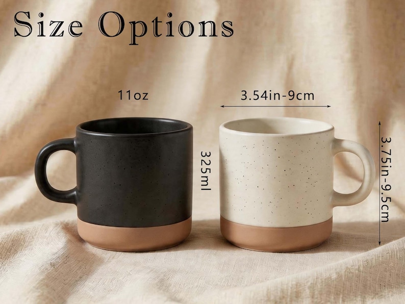 May include: Two ceramic mugs with handles, one matte black and one speckled off-white, both featuring a solid terracotta base. Text reads Size Options, 11oz, 325ml, 3.54in-9cm, and 3.75in-9.5cm, indicating dimensions for these cylindrical vessels.