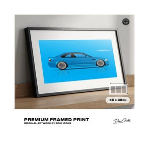 May include: Framed print featuring a blue sports car illustration on a light blue background. The print is in a black frame and measures 55 x 28cm. Text at the bottom reads "PREMIUM FRAMED PRINT" and "ORIGINAL ARTWORK BY GRID ICONS."
