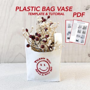 May include: A set of three ceramic mugs with a speckled, matte finish. The mugs are in shades of cream, light gray, and dark gray. Each mug has a simple, minimalist design and a rounded handle. Perfect for coffee or tea.