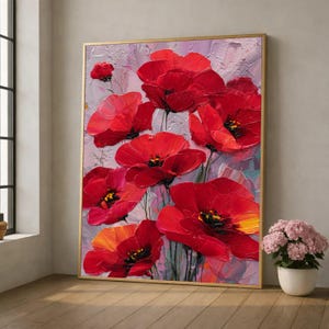 May include: A framed oil painting of vivid red poppy flowers with yellow centres set against a textured, pale purple backdrop. The artwork is in a gold-coloured frame, creating a striking contrast. The painting is a floral theme.