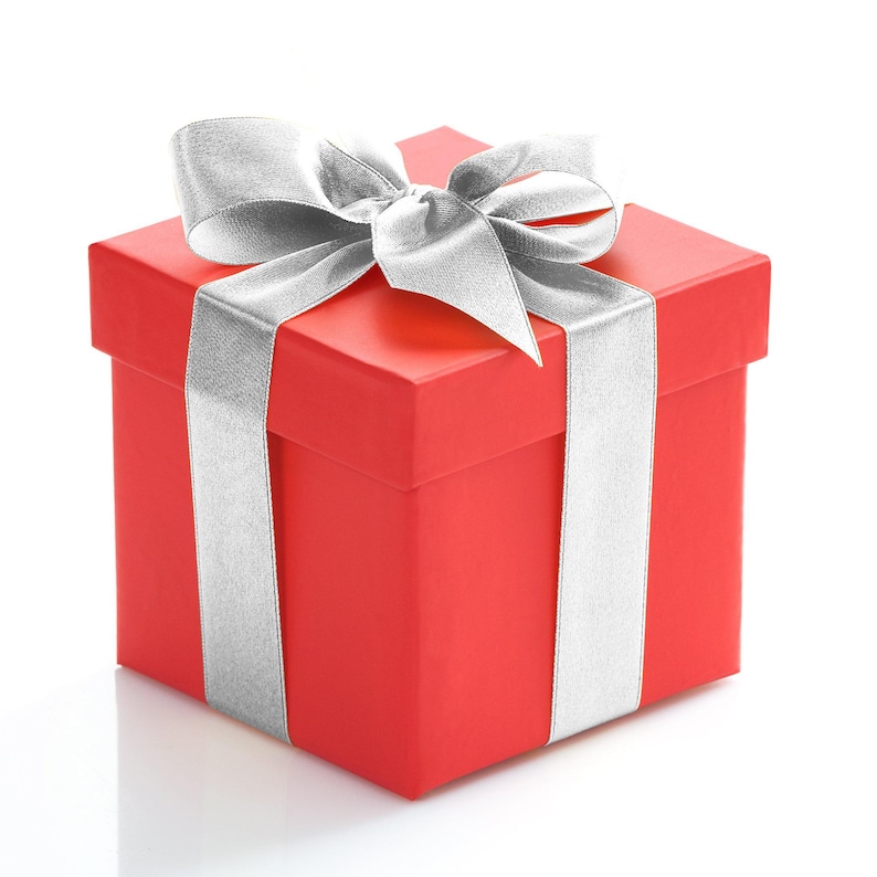 May include: A square red gift box with a smooth matte finish, wrapped with a wide, shimmering silver ribbon tied into a large, structured bow on the top lid. The ribbon extends vertically and horizontally around the box, creating a classic presentation.