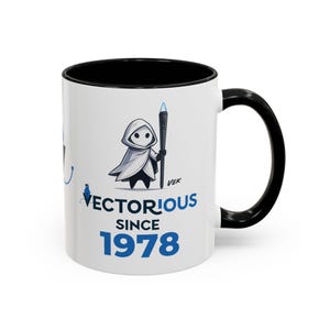 May include: A white ceramic mug with a black interior and handle. The front features a graphic of a hooded figure holding a glowing blue torch, with the text "VECTORIOUS SINCE 1978" printed in blue and black, incorporating a fountain pen nib icon.
