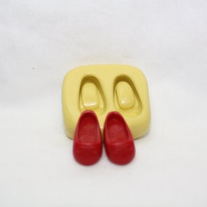 De schoenen van de baby, siliconenmal, Rode schoenen