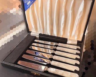 A set of six Eales of Sheffield knives with mother-of-pearl handles.