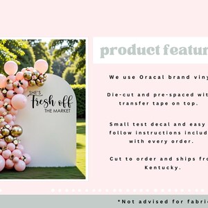 May include: A white arch-shaped sign with the text "She's Fresh off the Market" is decorated with pink and gold balloons. The sign is set up on a green lawn with trees in the background.