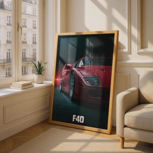 May include: A framed vertical wall art print featuring a red F40 sports car in a dark setting. The car is angled toward the viewer, showcasing its headlights and body lines. The text F40 is printed in white at the bottom of the dark background.