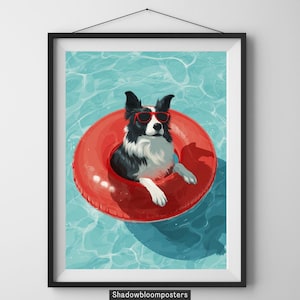 May include: A framed art print featuring a black and white dog wearing red sunglasses and floating in a red inner tube in a pool. The water is a light blue color. The print is framed in a black frame.