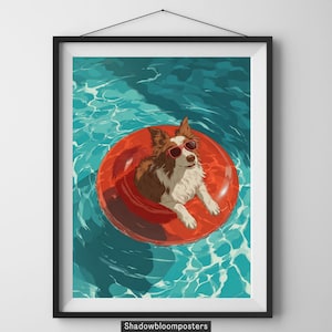 May include: Framed art print featuring a dog wearing sunglasses and floating in a red inner tube in a pool. The dog has brown and white fur. The water is a bright blue color. The print is in a black frame.