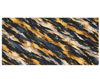May include: A rectangular mat featuring an abstract pattern of diagonal, sweeping brushstrokes in metallic gold, deep navy blue, and soft cream. The design incorporates textured, splattered paint effects across the entire surface.