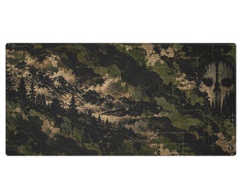 May include: A rectangular desk mat featuring a dark green and black camouflage-style landscape with silhouettes of pine trees, mountain ranges, and a prominent skull graphic on the right side, overlaid with thin white grid lines.