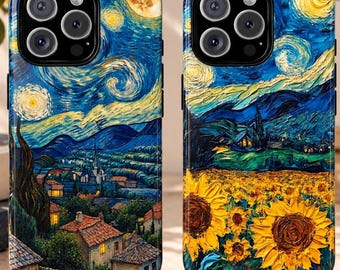 May include: Two smartphone cases featuring artistic prints inspired by Van Gogh. The left case displays a night village scene with swirling blue skies and a moon. The right case shows a field of yellow sunflowers under a blue, starry night sky.