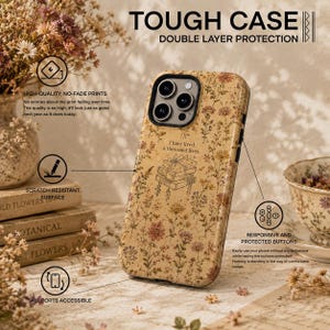May include: A beige phone case with a floral pattern and a central illustration of a stack of books with the text I have lived a thousand lives. The case features double-layer protection, a scratch-resistant surface, responsive buttons, and accessible ports.