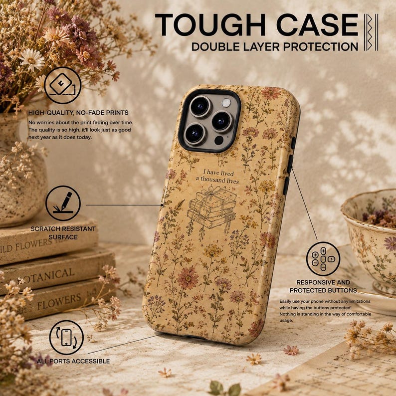 May include: A beige phone case with a floral pattern and a central illustration of a stack of books with the text I have lived a thousand lives. The case features double-layer protection, a scratch-resistant surface, responsive buttons, and accessible ports.