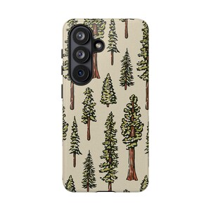 May include: A phone case with a beige background featuring a repeating pattern of green and brown trees. The trees vary in size and style, with some having detailed green foliage and brown trunks. The case has a camera module on the upper left.