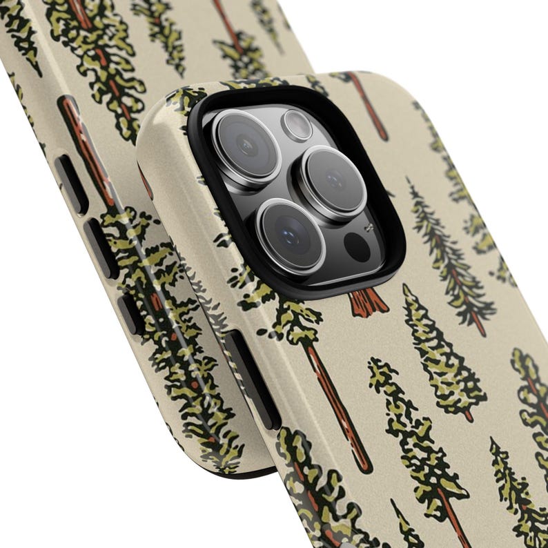 May include: Two phone cases with a repeating pattern of stylized trees in brown, green, and beige. The cases have a glossy finish and a black camera lens protector.