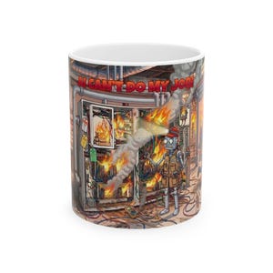 May include: White ceramic mug featuring a cartoon illustration of a robot in a burning electrical panel. The robot wears a red cap and work vest. The text "I CAN'T DO MY JOB!" is printed on the top of the mug.