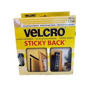 May include: A yellow and white box of VELCRO brand sticky back fasteners. The box displays the brand name, product information, and examples of use. The box is labeled "15 ft / 4.5 m".