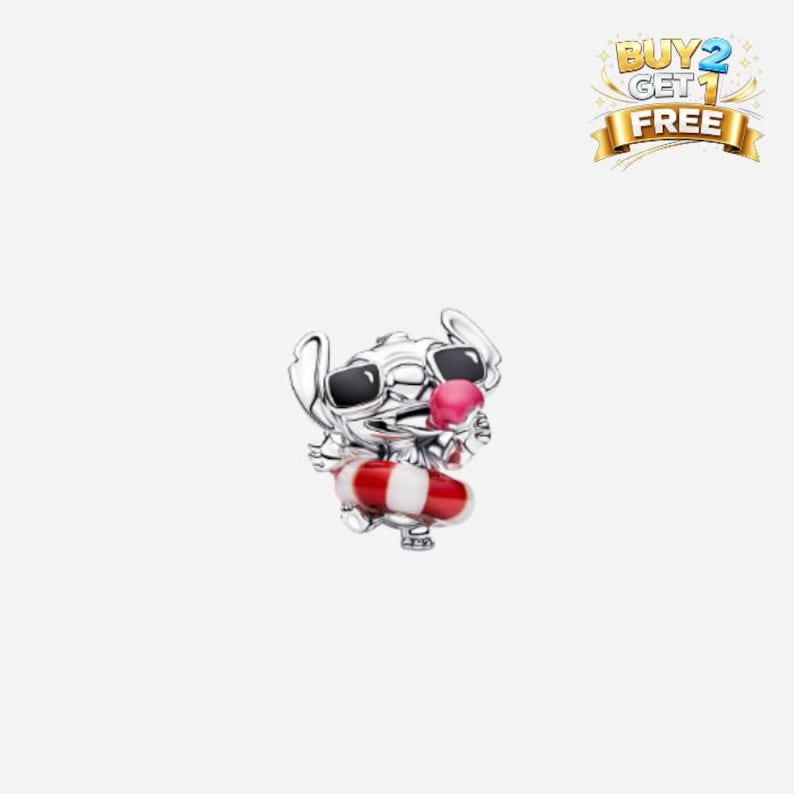 May include: A silver charm featuring a cartoon character wearing sunglasses and a pink tongue sticking out. The character is holding a red and white striped floatation device. The charm has a Buy 2 Get 1 Free banner.