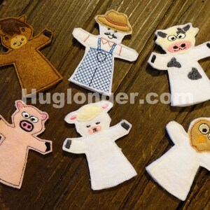 May include: Set of six felt finger puppets featuring a farmer, horse, cow, pig, sheep, and owl. The puppets are all white with embroidered details and are perfect for imaginative play.