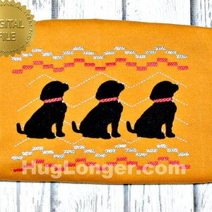 May include: Embroidered design of three black labrador retrievers sitting in a row on a mustard yellow background. The dogs are outlined in white and have red collars. The background has a repeating pattern of red and white lines.