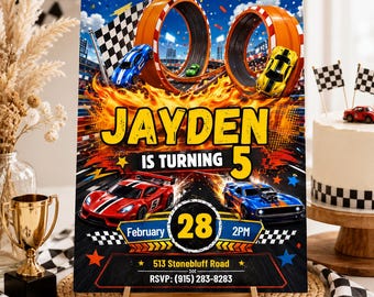 May include: A rectangular birthday party invitation sign featuring a race car theme with orange loop tracks, a checkered flag, and flames. The text reads: JAYDEN IS TURNING 5, February 28, 2PM, 513 Stonebluff Road, and RSVP: (915) 283-8283.