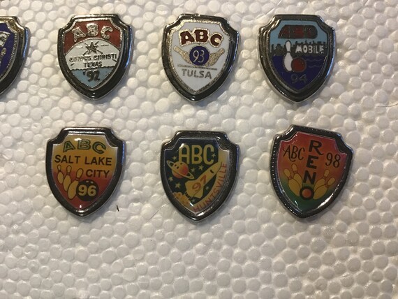 Collection of 16 ABC tournament shield pins - image 5