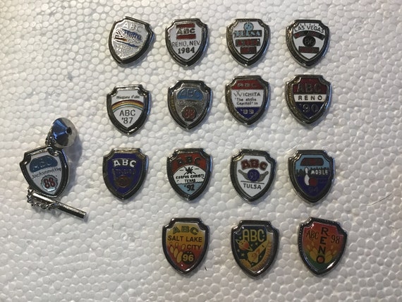 Collection of 16 ABC tournament shield pins - image 1