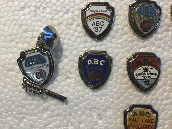 Collection of 16 ABC tournament shield pins - image 3