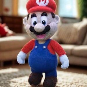 May include: A handmade crochet doll of a popular video game character. The doll features a red hat with a white emblem, a black mustache, and blue overalls. The doll has a round belly and brown shoes.