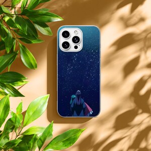 May include: A smartphone case featuring a dark blue night sky filled with white stars. The design depicts two figures viewed from behind, standing together and looking up at the vast, starry expanse. The case has a white camera lens cutout.