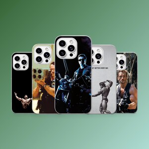 May include: A collection of five phone cases featuring images of Arnold Schwarzenegger in various action poses. The cases display images from the Terminator, Predator, and bodybuilding eras. One case has the text "GET BETTER EVERY DAY."