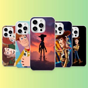 May include: Five smartphone cases featuring various illustrations of the character Woody from Toy Story. The designs include close-up portraits, a silhouette against a sunset, and a full-body depiction of the cowboy character on different backgrounds.