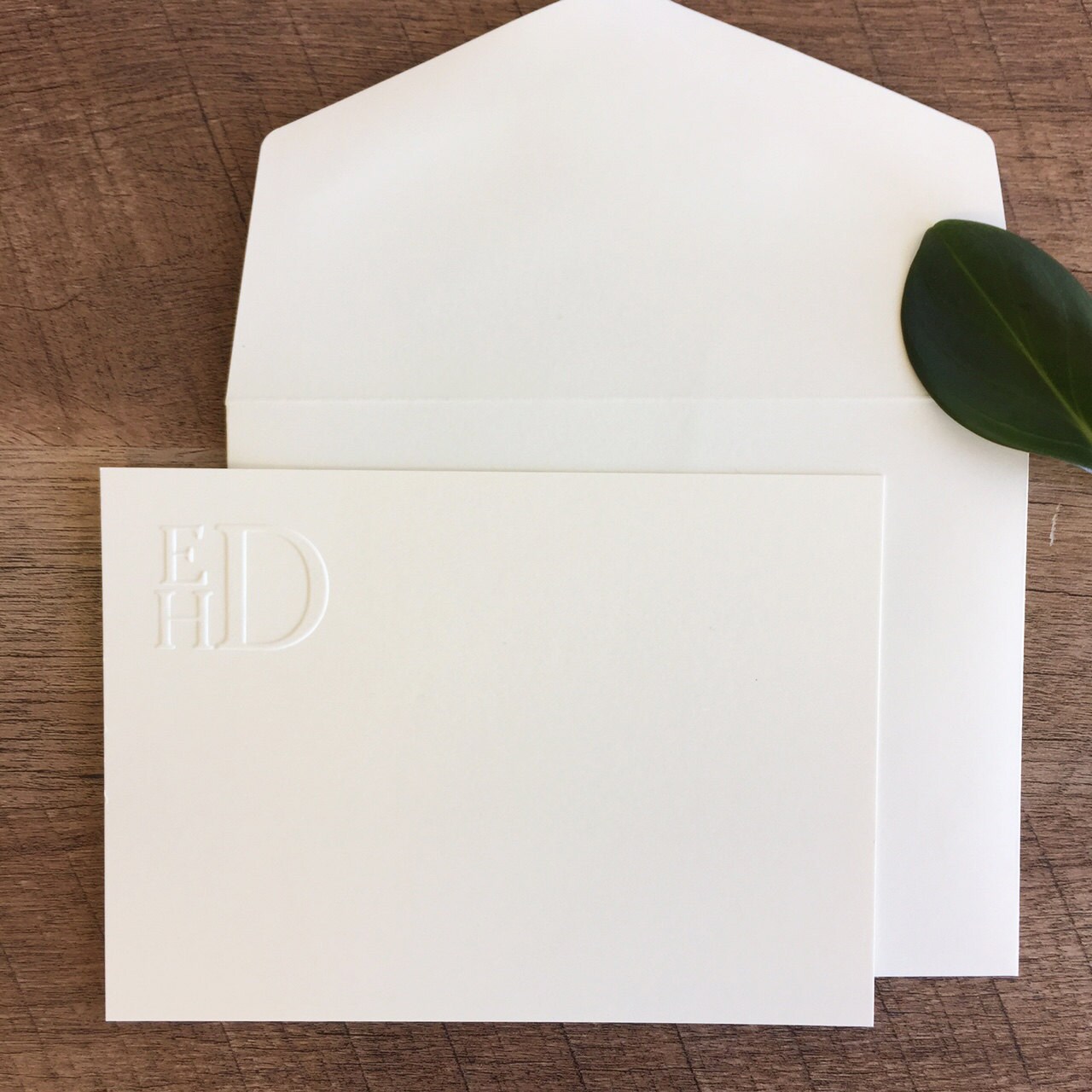stacked embossed monogram stationery