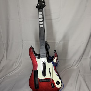 May include: A set of three ceramic mugs with a speckled, matte finish. The mugs are in shades of cream, light gray, and dark gray. Each mug has a simple, minimalist design and a rounded handle.