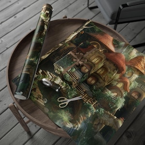 May include: A roll of wrapping paper, a wrapped gift, and wrapping paper sheets featuring a fantasy village scene with red-roofed buildings and lush greenery. A pair of scissors and a tape dispenser are also on the wooden table.