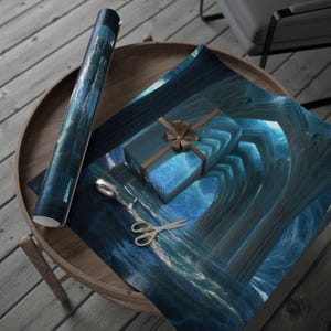 May include: A roll of blue wrapping paper and a wrapped gift box with a brown ribbon sit on a wooden table. The wrapping paper and gift box feature a blue and white abstract design. Gold scissors are also on the table.