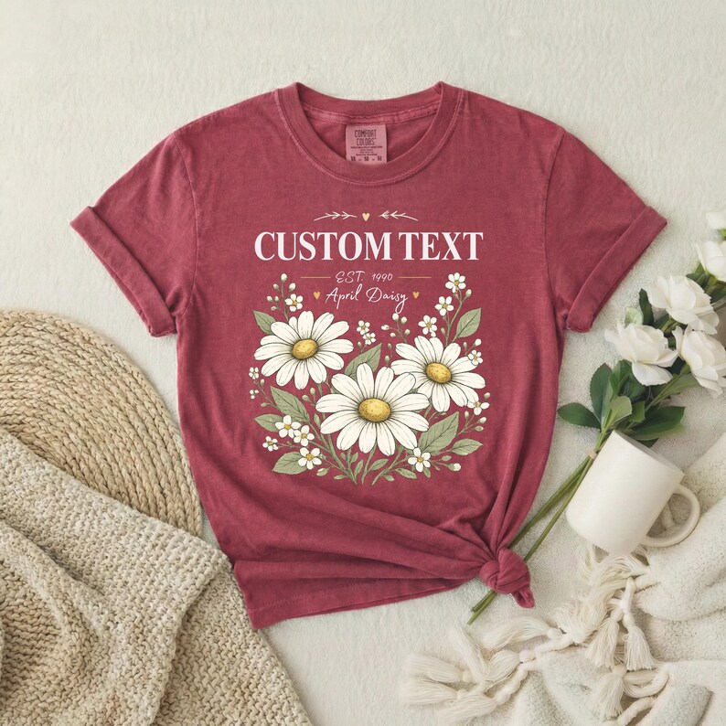 Custom text daisy birth flower shirt in dusty rose with white daisies, vintage relaxed unisex tee, garment dyed cotton.