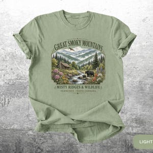 National park inspired shirt with mountains, trees, creek, and flowers