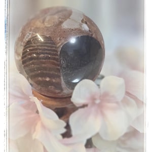 May include: A rustic wooden sign with the text "Welcome to our home" in white lettering. The sign features a distressed finish and a simple, inviting design, perfect for entryway decor.