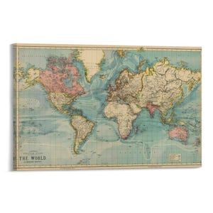 May include: A vintage world map print with a cream-colored background and a detailed depiction of continents and oceans. The map features pastel colors, including pink, blue, and yellow, and includes the text "LETTER POPULAR ATLAS THE WORLD."